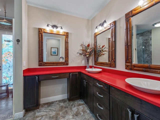 622 Bimini Ave, Marco Island, FL 34145 - bathroom featuring double vanity and baseboards