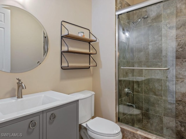 622 Bimini Ave, Marco Island, FL 34145 - bathroom featuring a shower stall, toilet, and vanity