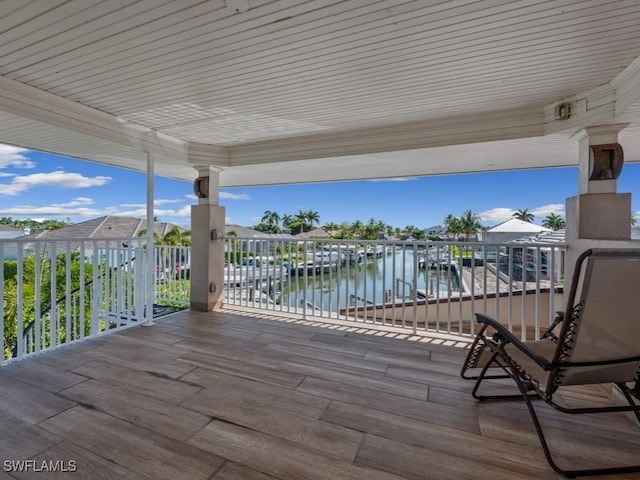 622 Bimini Ave, Marco Island, FL 34145 - wooden deck with a water view and a boat dock