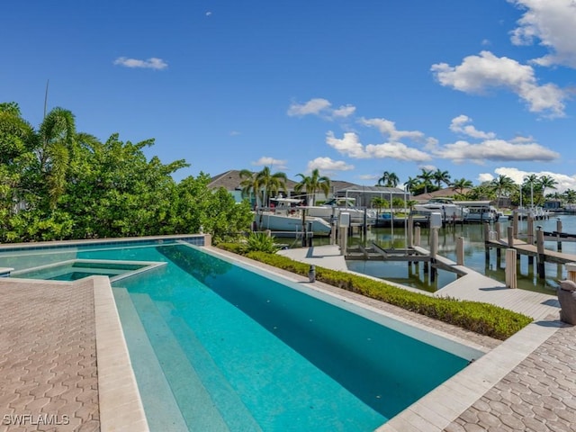 622 Bimini Ave, Marco Island, FL 34145 - view of pool with boat lift, a boat dock, a water view, and a pool with connected hot tub