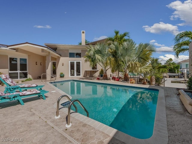 622 Bimini Ave, Marco Island, FL 34145 - outdoor pool with french doors and a patio area