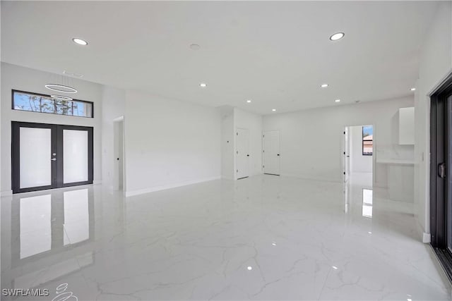 3300 18th St W, Lehigh Acres, FL 33971 - spare room with recessed lighting, light marble finish flooring, and baseboards