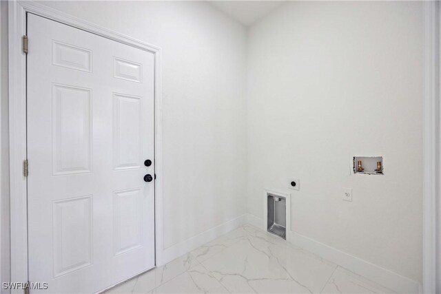3300 18th St W, Lehigh Acres, FL 33971 - clothes washing area with hookup for an electric dryer, light marble finish flooring, hookup for a washing machine, and baseboards