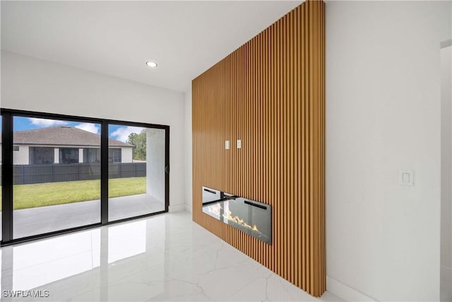 3300 18th St W, Lehigh Acres, FL 33971 - unfurnished living room featuring marble tiled floors and recessed lighting