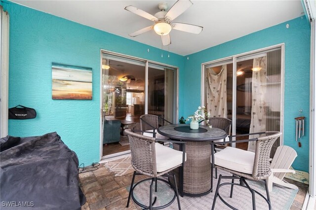 9750 Sassafras Ct, Estero, FL 33928 - dining area featuring ceiling fan and a textured wall