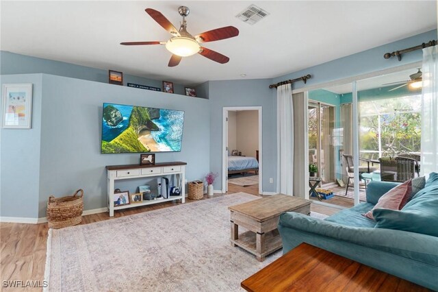 9750 Sassafras Ct, Estero, FL 33928 - living room with a ceiling fan, wood finished floors, and baseboards