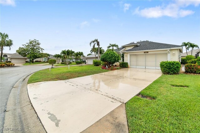 9750 Sassafras Ct, Estero, FL 33928 - ranch-style home with concrete driveway, a front yard, a garage, and a shingled roof