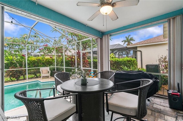 9750 Sassafras Ct, Estero, FL 33928 - sunroom with ceiling fan and outdoor dining area