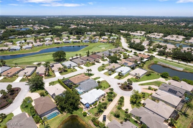 9750 Sassafras Ct, Estero, FL 33928 - aerial view of property and surrounding area with a large body of water, a golf club, and nearby suburban area