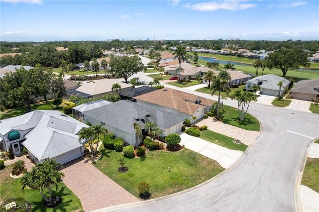 9750 Sassafras Ct, Estero, FL 33928 - aerial perspective of suburban area with a nearby body of water