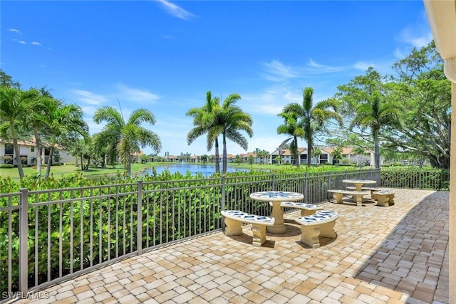 8336 Charter Club Cir Unit 10, Fort Myers, FL 33919 - view of patio / terrace with a water view and fence