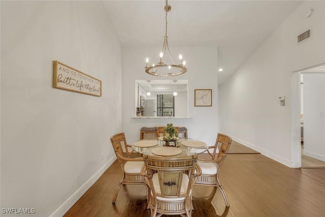 8336 Charter Club Cir Unit 10, Fort Myers, FL 33919 - dining room with wood finished floors, a chandelier, and baseboards