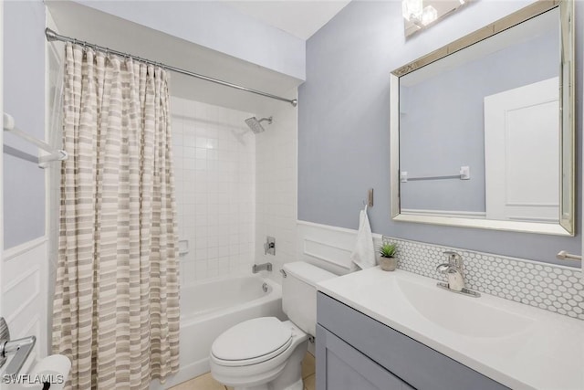 8336 Charter Club Cir Unit 10, Fort Myers, FL 33919 - full bathroom featuring toilet, wainscoting, shower / bath combination with curtain, and vanity
