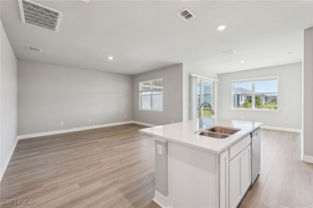 16678 Expedition Ct, Punta Gorda, FL 33982 - kitchen featuring a sink, open floor plan, stainless steel dishwasher, light wood finished floors, and recessed lighting