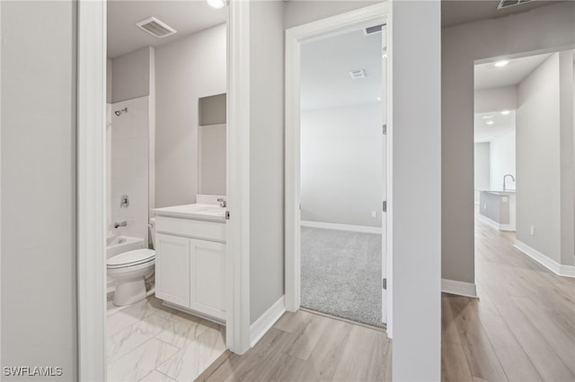 16678 Expedition Ct, Punta Gorda, FL 33982 - bathroom featuring toilet, vanity, shower / bathtub combination, recessed lighting, and baseboards