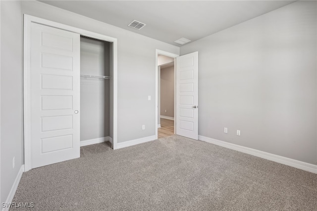 16678 Expedition Ct, Punta Gorda, FL 33982 - unfurnished bedroom with carpet, baseboards, and a closet