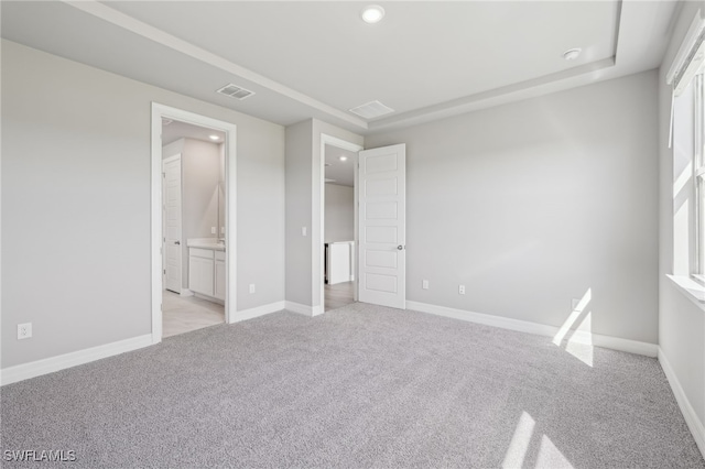 16678 Expedition Ct, Punta Gorda, FL 33982 - unfurnished bedroom with light colored carpet, recessed lighting, baseboards, and ensuite bath