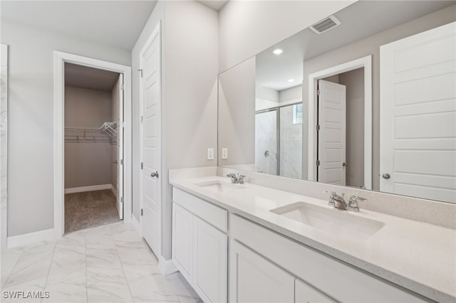 16678 Expedition Ct, Punta Gorda, FL 33982 - full bath with a stall shower, a walk in closet, marble finish floors, double vanity, and baseboards