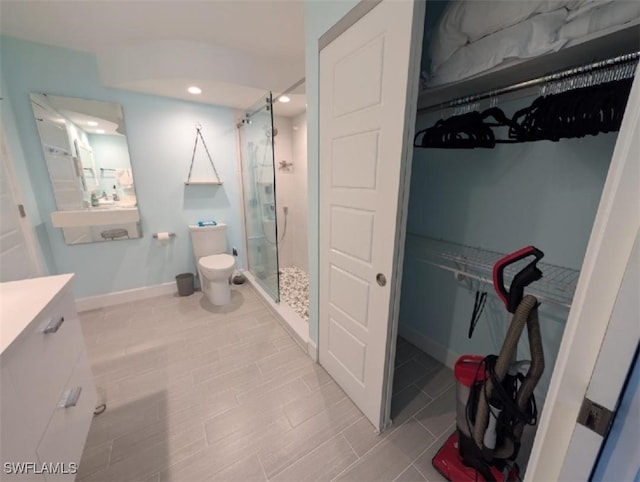 2111 Barkeley Ln Unit 13, Fort Myers, FL 33907 - full bath featuring a shower stall, vanity, a walk in closet, toilet, and baseboards