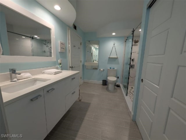 2111 Barkeley Ln Unit 13, Fort Myers, FL 33907 - full bath with a stall shower, vanity, baseboards, toilet, and recessed lighting