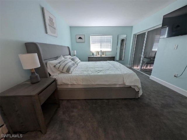 2111 Barkeley Ln Unit 13, Fort Myers, FL 33907 - bedroom featuring dark carpet and baseboards