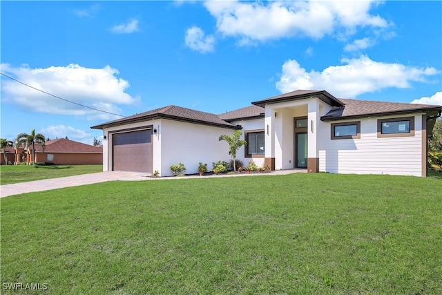 2721 NW 10th Ter, Cape Coral, FL 33993 - prairie-style house featuring driveway, a front lawn, a garage, and a shingled roof