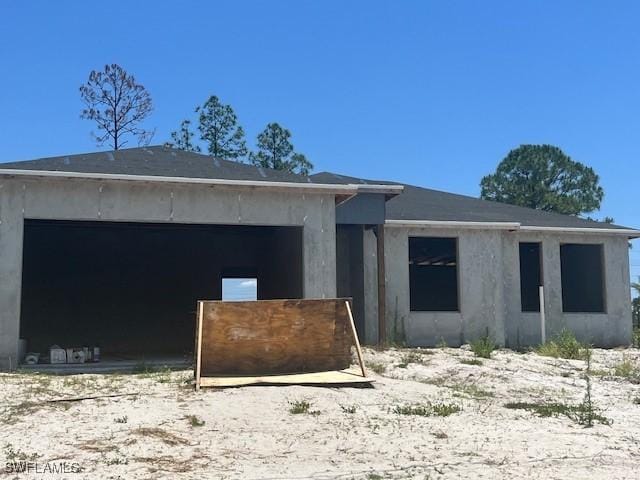 817 Crystal Ave S, Lehigh Acres, FL 33974 - unfinished property featuring stucco siding