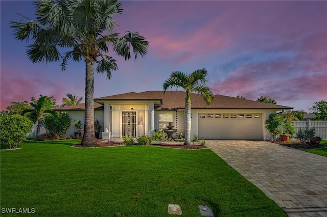 1811 NE 5th Ter, Cape Coral, FL 33909 - ranch-style house with stucco siding, an attached garage, and decorative driveway