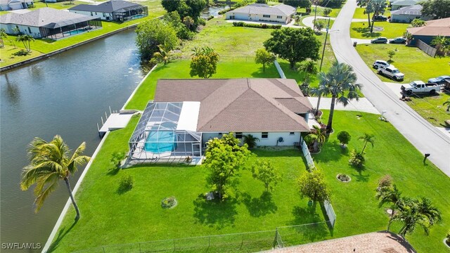 1811 NE 5th Ter, Cape Coral, FL 33909 - aerial perspective of suburban area featuring a nearby body of water