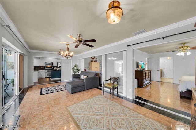 1811 NE 5th Ter, Cape Coral, FL 33909 - living area with a ceiling fan, ornamental molding, a chandelier, and inlaid floor details