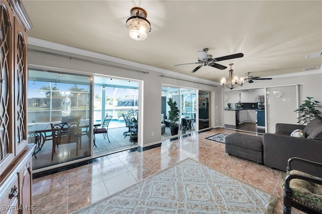 1811 NE 5th Ter, Cape Coral, FL 33909 - tiled living room featuring a ceiling fan, crown molding, and a chandelier
