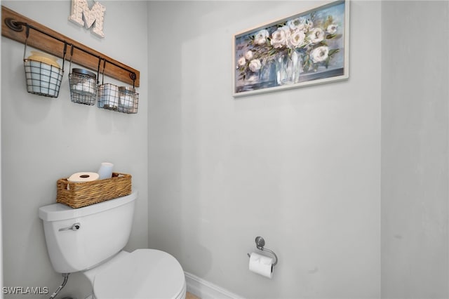 1811 NE 5th Ter, Cape Coral, FL 33909 - bathroom featuring toilet and baseboards