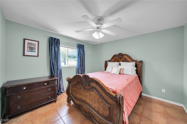 1811 NE 5th Ter, Cape Coral, FL 33909 - bedroom featuring light tile patterned floors and a ceiling fan