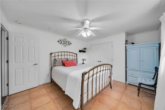1811 NE 5th Ter, Cape Coral, FL 33909 - bedroom with light tile patterned flooring, a closet, ceiling fan, and ornamental molding