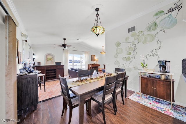 1811 NE 5th Ter, Cape Coral, FL 33909 - dining space with dark wood finished floors, a ceiling fan, vaulted ceiling, ornamental molding, and beverage cooler