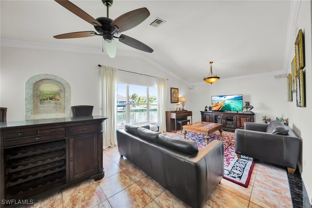 1811 NE 5th Ter, Cape Coral, FL 33909 - living room featuring lofted ceiling, crown molding, and a ceiling fan
