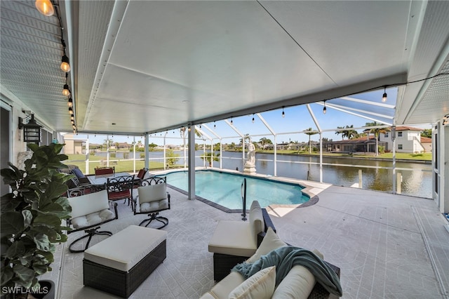 1811 NE 5th Ter, Cape Coral, FL 33909 - swimming pool featuring a patio, a water view, outdoor lounge area, and glass enclosure