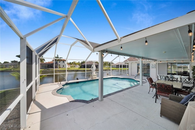 1811 NE 5th Ter, Cape Coral, FL 33909 - swimming pool with a patio, a water view, glass enclosure, and outdoor dining space