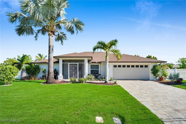 1811 NE 5th Ter, Cape Coral, FL 33909 - view of front of home featuring stucco siding, an attached garage, and decorative driveway
