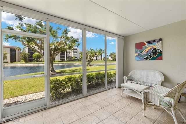 9900 Sunset Cove Ln Unit 111, Fort Myers, FL 33919 - sunroom featuring a water view and plenty of natural light