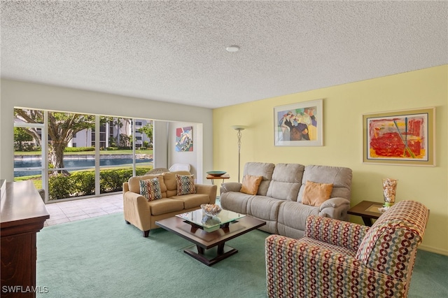 9900 Sunset Cove Ln Unit 111, Fort Myers, FL 33919 - carpeted living area featuring a textured ceiling