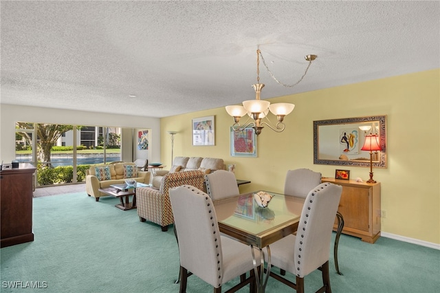 9900 Sunset Cove Ln Unit 111, Fort Myers, FL 33919 - carpeted dining area with a chandelier and a textured ceiling