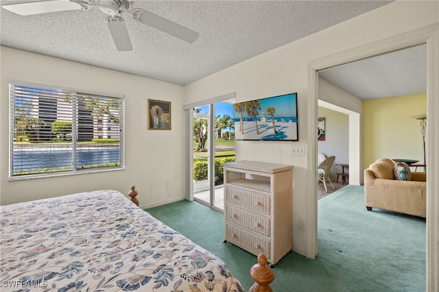 9900 Sunset Cove Ln Unit 111, Fort Myers, FL 33919 - bedroom featuring carpet floors, access to outside, a textured ceiling, and a ceiling fan