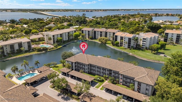 9900 Sunset Cove Ln Unit 111, Fort Myers, FL 33919 - bird's eye view of a large body of water, apartment complex / building, and a pool