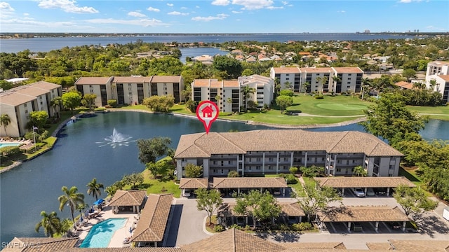 9900 Sunset Cove Ln Unit 111, Fort Myers, FL 33919 - aerial view of apartment complex, a large body of water, a pool area, and a golf course