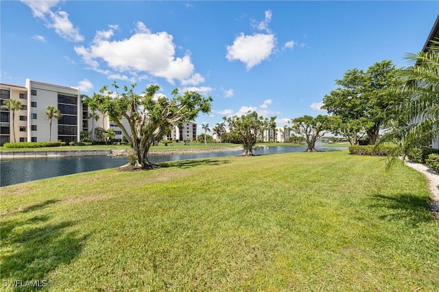 9900 Sunset Cove Ln Unit 111, Fort Myers, FL 33919 - view of green lawn featuring a water view