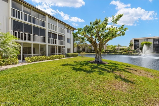 9900 Sunset Cove Ln Unit 111, Fort Myers, FL 33919 - surrounding community featuring a water view and a yard