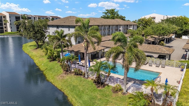 9900 Sunset Cove Ln Unit 111, Fort Myers, FL 33919 - view of subject property featuring a pool and a nearby body of water