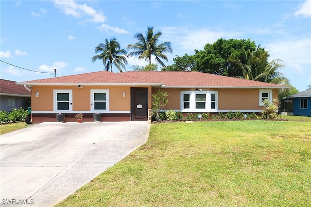ranch-style house with stucco siding and a front lawn