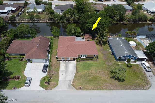 view of property location with a large body of water and nearby suburban area